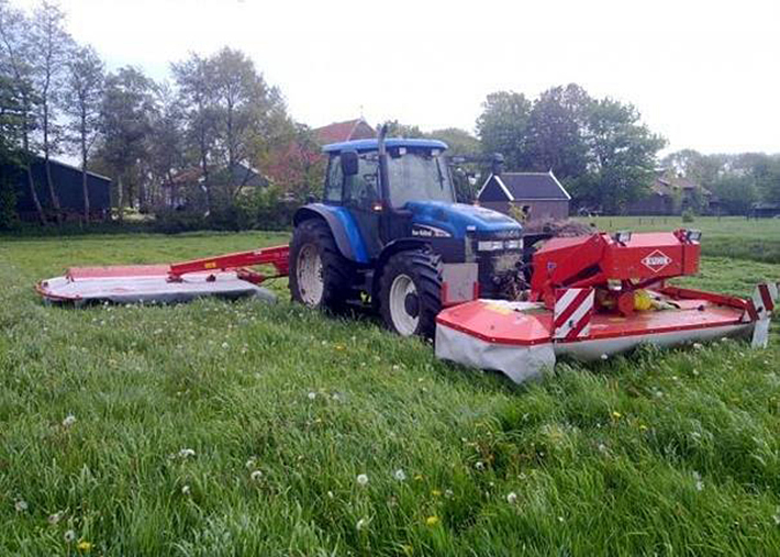 Mowing grass silage, which will be stored for cow feed.